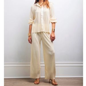 Creme plisse high waisted pants and blouse.